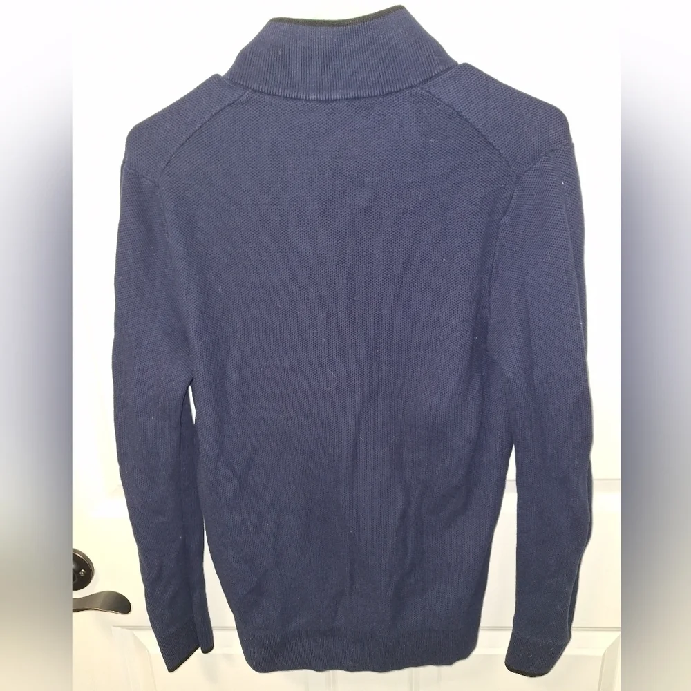 A Michael Kors men's 1/4 zip 100% cotton sweater in a size medium.
